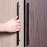 a hand opening a cabinet using an appliance pull, cabinet pull