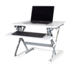 PLUS 35" sit stand workstation fully extended with a laptop on the surface. 